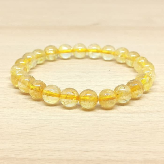 Bracelet boule 08 mm de citrine chauffée. La citrine possède des bienfaits.